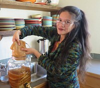 Nina giving away SCOBYs at a Martha's Vineyard Kulture Kombucha tasting. Photo by Erik Albert. Painter, mom, nurse, grower and maker of things.