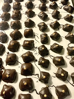 Pretzel Bites - peanut butter filled pretzels dipped in non-dairy caramel, dipped in dark chocolate